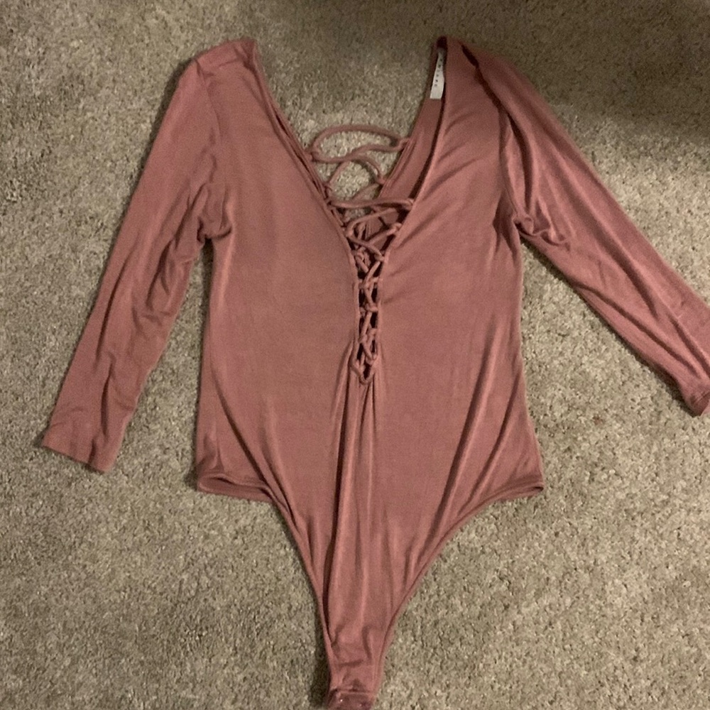 Pink bodysuit, tie cutout front and back